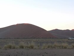 Vehicle parked next to dune, Sossusvlei, Namib-Naukluft, Namibia Stock Footage