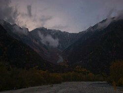 T/L dawn breaking over autumn valley in mountains, Kamikochi, Japan Stock Footage