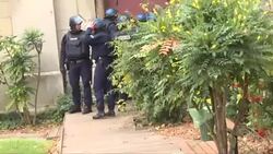 CLEAN : Police break down church door during raid north of Paris News Clip