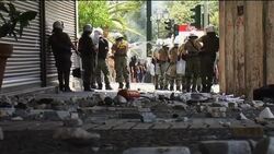 Policemen injured in clashes with protesters News Clip