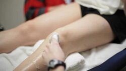 Patient Leg Pain Treatment with Ultra Sound at Clinic Health Center Stock Footage