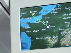 Airplane monitor showing different map views of London-Milan travel Stock Footage