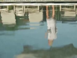 pool water hotel resort lodge woman guest reflection sunbaking sun basking sun tanning holiday vacation getaway Stock Footage