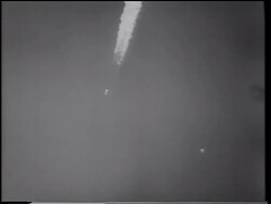B/W 1961 long shot Mercury 3 rocket ascending in sky / Alan Shepard - first American in space Stock Footage
