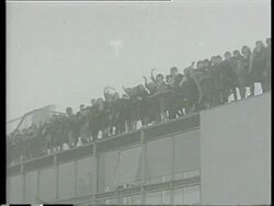 1964 MONTAGE MS George Harrison and John Lennon, with wife Cynthia, boarding Pan Am flight from Heathrow Airport bound for New York / LA WS Fans waving / The Beatles walking up steps / WS Fans waving on February 7, 1964 / London, England Stock Footage