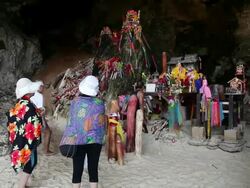 MS Tourists looking  at scuptures in cave / Krabi, Krabi, Thailand Stock Footage