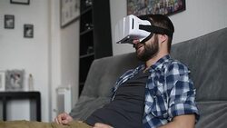 Young adult man and a virtual reality headset. Guy using vr glasses Stock Footage