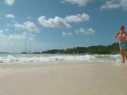 HD SLOW-MOTION: Running On A Beach Stock Footage
