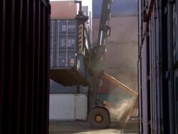 MS forklift lifting container and moving with smoke / Los Angeles, California, United States Stock Footage