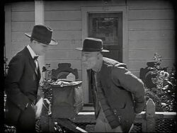 Lon Chaney Sr as Chinese man talks with customer Stock Footage