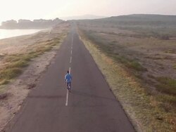 Man walking on street aerial view Stock Footage
