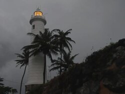 MS View of Galle lighthouse at dusk on stormy night / Galle, Southern Province, Sri Lanka Stock Footage