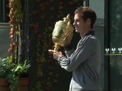 Andy Murray posing with Wimbledon Trophy News Clip