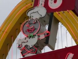 Rack focus of the original "Speedee" road sign at the McDonald's #1 Store Museum Stock Footage