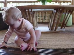 MS Shot of baby sitting up by himself / Ubud, Bali, Indonesia Stock Footage
