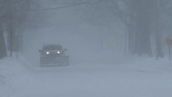 Historic Blizzard, Snowstorm, Whiteout Conditions - Snow Plow Clearing Street Stock Footage