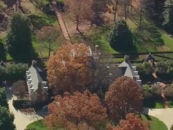 MS AERIAL DS ZI Colonial Style House surrounded by trees near Greenville / South Carolina, United States Stock Footage