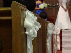 Details of a wedding in a church and the pews. - Model Released - 1920x1080 - HD Stock Footage