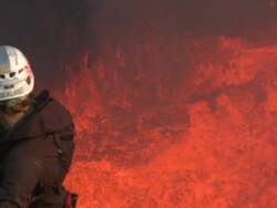 Climber admires spectacular volcanic eruption of lava, Marum Volcano, Ambrym Island, Vanuatu Stock Footage