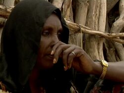 Woman next to wooden hut Stock Footage