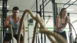 Slow motion scene of crossfit battle rope exercises Stock Footage