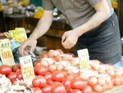 MS TD TU Shot of Greengrocer man is on display in storefront tomatoes / Toyooka, Hyogo, Japan Stock Footage