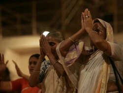 MS Women worshiping at night near Ganges / Varanasi, India Stock Footage