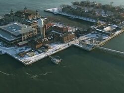 Aerial shot of Ellis Island covered in snow NYC Stock Footage