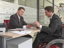 HD DOLLY: Disabled Businessman Having Meeting Stock Footage