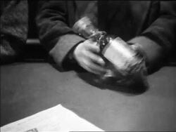 B/W 1933 close up man putting bottle of liquor in coat / repeal of Prohibition / Pennsylvania Stock Footage