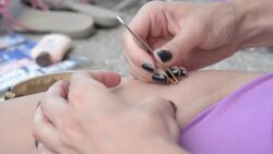 Waxing legs with tweezers Stock Footage