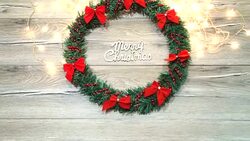 Christmas wreath with decorations on the shabby wooden background Stock Footage