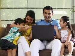 Family chatting on a laptop  Stock Footage