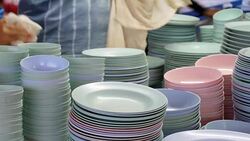 Cleaning dish with towel Stock Footage