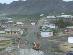 WS PAN View of Bus driving to village in Ecuador / Ecuador Stock Footage