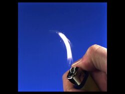 High Speed Lighter being lit, blue screen (2000fps, shutter speed 1/2000) Stock Footage
