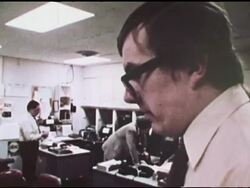 ABC News producer speaking to reporter about story Stock Footage