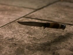High speed Knife falling on pavement Stock Footage