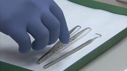 Dental Equipment & Floss on a Model Patient News Clip