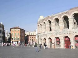 MS PAN Tourists roaming in front of Arena di Verona at Piazza Bra / Verona, Veneto, Italy Stock Footage
