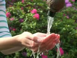CU Young womans hand drinking water from well / Saarburg, Rhineland-Palatinate, Germany Stock Footage
