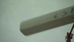 A radar antenna rotates atop a communications tower. Stock Footage