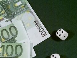 MS SLO MO Game of dice on pile of 100 euro bills /vieux pont en auge, Normandy, France Stock Footage