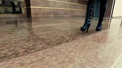 Woman in high heeled boots going up stone staircase Stock Footage