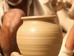 Man making a earthen pot on a pottery wheel, Faridabad, Haryana, India Stock Footage