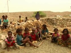 Group of children sitting on the ground Stock Footage