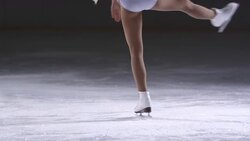 SLO MO TU Female skater in a upright spin variation Stock Footage