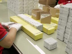WS ZI Young women folding paper at factory / Shenzhen, Guangdong, China Stock Footage