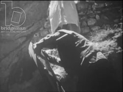 Insane people in small Moroccan vilage are put into an underground bunker, religious leaders exorcise people by hitting them with a shoe, c.1960 Stock Footage