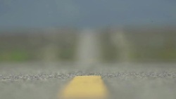 Detail of an empty scenic desert road. - Slow Motion Stock Footage